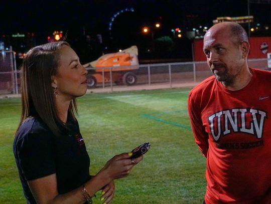 Ashly Dickinson interviewing Coach Chris Shaw after the game.